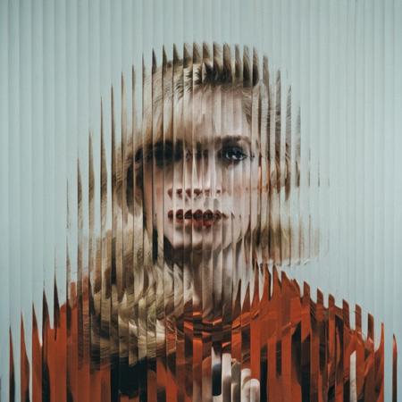 <lora:SDXL_Textured_glass_Test_Sa_May:1>  a  blond woman , red dress,  curved glass,  textured glass, fluted glass