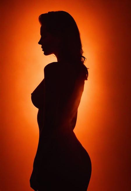 aesthetic photoshoot of woman in silhouette photography, with orange light shadows on her back, with subtle smoke captured in RAW format, allowing for maximum flexibility in post-processing and preserving the highest quality of image data.