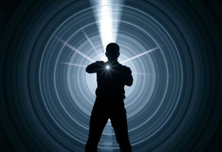 A chrome and silver beam hitting a human 100 metres away. The beam is about 1 metre thick and surrounded by multiple concentric grey and white circles of varying diameter. The target is silhouetted and is in an action hero pose