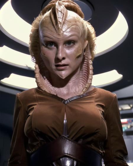 vaadwaur alien [hair color] updo hair beige skin reptilian lizard spikes on forehead reptile earholes cobra hood on neck long pointed chin wearing brown iridescent sci-fi clothes wearing brown belted leather and cloth vaadwaur military uniform