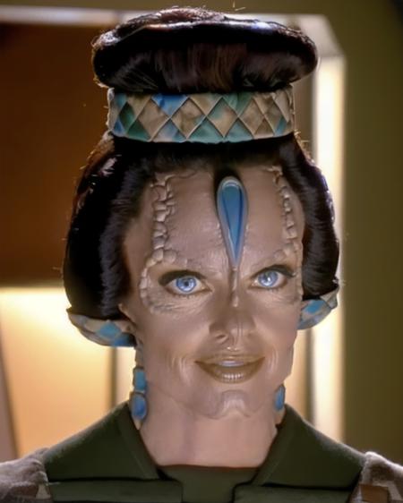 cardassian, female, gilora, grey skin, reptile scales on sides of neck, elaborate updo hair with square pattern headbands, wearing green square pattern tunic, perfecteyes eyes, pores, medium shot, front view, (raw photo:1.2), fujifilm x100v, standing in a sci-fi starship, 8k, tracy scoggins, <lora:cardassian_lora_v2:0.7>, <lora:locon_perfecteyes_v1_from_v1_64_32:0.3>