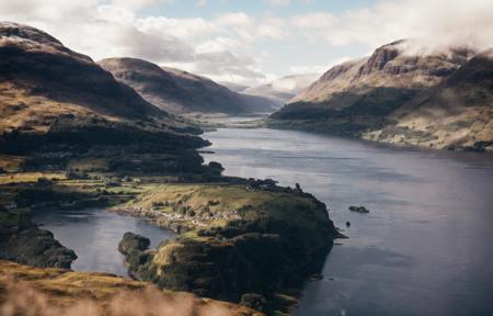 photo of (scottish highlands:1.3), panoramic view, (mountains:1.3), (castle:0.6), (Loch Ness:1.2), big lake, sunny with clouds, cinematic lighting, (misty:0.8), golden hour, god rays, 8K, (highly detailed:1.5), (ultra-realistic:1.5), masterpiece, Hasselblad,  (ag400:1.2) (film grain) <lora:Analog Style Agfa:0.9>
