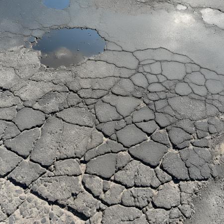 cinematic photo desert road, cracked asphalt texture, weathered, dark,  wet, water puddles, cracks, simple background
 <lora:asphalt-SDXL-m:1> . 35mm photograph, film, bokeh, professional, 4k, highly detailed