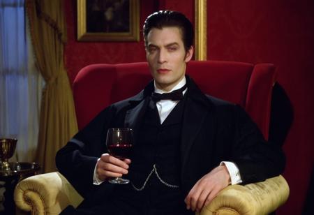 cinematic film still close-up of a vampire man with (pale skin:1.1) in a dark suit, sitting on a red armchair in a victorian living room, holding a glass of red wine, warm candle light at night, <lora:h4mm3r:0.8>