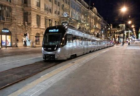 Raw photo,( shallow depth of image:1.2), (minimalistic:1.4), outdoors, wide shot of the downtown of Helsinki, tram, bike riders, night, black bullet train, 38 mm photograph, professional, FOV, HDR, natural lighting, motion blur, lowfi, KodakPhotoMaybe, Photographer Reuben Wu Style