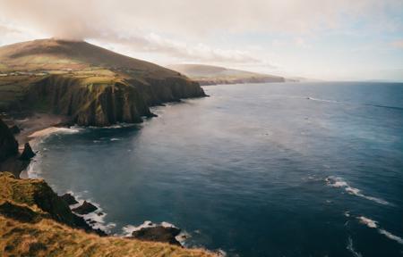 photo of (irish coast:1.3), Dingle, panoramic view, (mountains:1.3), (castle:0.6), sea, cliffs, sunny with clouds, cinematic lighting, (misty:0.8), golden hour, god rays, 8K, (highly detailed:1.5), (ultra-realistic:1.5), masterpiece, Hasselblad,  (ag400:1.2) (film grain) <lora:Analog Style Agfa:0.9>