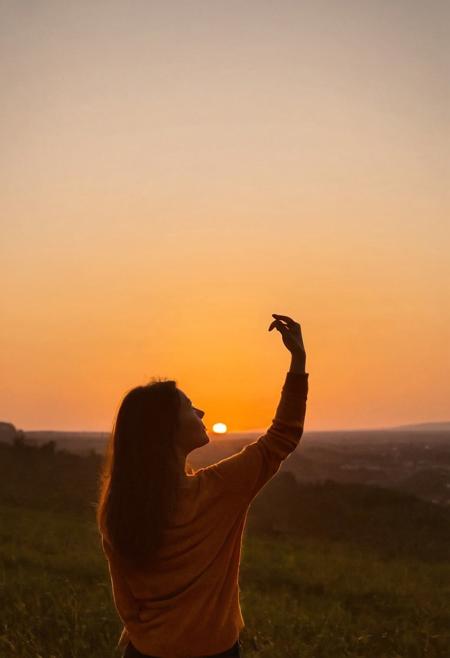 sunset, silhouette, woman, heart shape, hand gesture, warm colors, outdoor, dusk, sky, creative pose, backlit, soft focus, landscape, golden hour, tranquility, leisure activity, nature, serene, orange tones, casual attire
