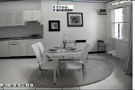 a living room with a table and chairs, window in the background, style_cctv