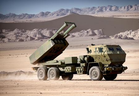 photo of a HIMARS parked in a desert <lora:himars16-v1-step50:1>