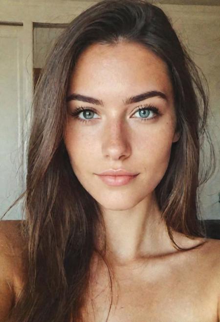 instagram selfie , a 23 year old gorgeous woman , slight smile , smooth skin face and eyes , natural lighting , at home , long hair, topless , film grain, low contrast, natural face , freckles , brown hair , blue eyes, dark circles under eyes, good eyelashes, full body