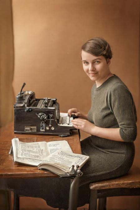 Hyperrealistic art  beautiful little-bit-overweight young 30 y.o. woman wearing (old-fashioned 50s knitted dress and dark hair:1.4), hands on typewriter keyboard, mid size breasts, shy smile, sitting in office chair at table and typing on typewriter in retro office, old telephone on table, books on table . Extremely high-resolution details, photographic, realism pushed to extreme, fine texture, incredibly lifelike   <lora:Valika_1024_cap:0.8>  <lora:Oldtimer_cb:0.8>