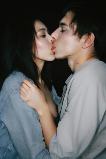 too cute to be true, mature woman,  close-up, messy hair, (nip slip:0.2), baggy clothes, armpit, full body, natural, no makeup, looking at viewer, finger on her lips, (((two men and one woman))) (((men kissing woman))) , threesome, (((two men)))