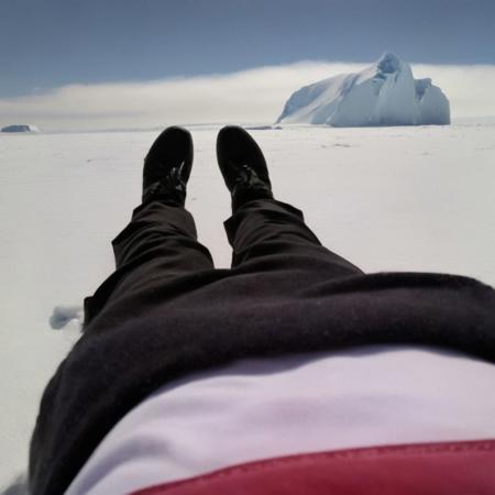 girl laying in the antarctic<lora:POV-step00015000:1>