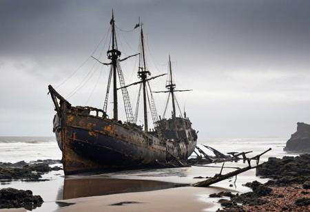 A shipwreck, battered by time and sea, lies stranded on a desolate shore. The skeletal frame of the vessel is a silent testament to the unforgiving nature of the elements. style of Richard Anderson and style of Gris Grimly and style of Norman Ackroyd