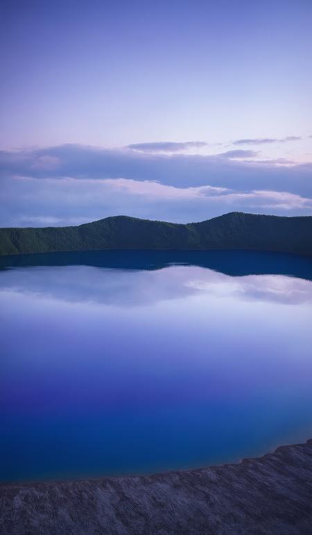 Calm purple evening light, of blue hour, deep blue Lake Mashu in a crater, Akan Mashu National Park, Hokkaido, Japan, Asia, copy space, design template, breathtaking photograph, dramatic light, award-winning, professional, highly detailed . 35mm photograph, film, bokeh, professional, 4k ,minimalistic, daylight, warm atmosphere, <lora:add-detail-xl:1>, cinematic look, <lora:SDXLHighDetail:0.3>