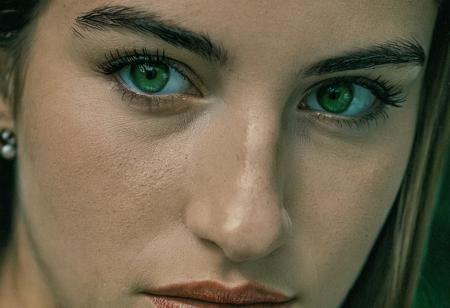 Photography in (stvmccrr style), a young  Italian woman with striking  green eyes, upper body, erotic, cultural portrait, emotive humane photography, rich colors, analog film, film grain, kodachrome, intricate details, insanely detailed, natural lighting, 8k, hdr, masterpiece, award winning photography, Fine art photography style, film photography style