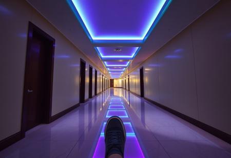 score_9, score_8_up, score_7_up, score_6_up, Ultra-realistic first-person POV video, as if a head-mounted camera races down a brand-new hotel corridor at night, with full physics-driven motion. The hallway is immaculate: smooth, cream-colored walls without blemish, glossy dark wood paneling, and perfectly aligned polished tile floors that reflect every flicker of light. Ceiling-mounted LED panels pulse softly in alternating teal and violet phosphorescent hues, casting an otherworldly glow across the corridor. Every guest room door stands ajar, each revealing a glimpse of something immaculate or slightly messy.
The camera’s movement is governed by a physics simulation: each footfall produces a realistic head-bob and inertial sway. When the runner’s shoe contacts the tile, the view shifts slightly—micro-jolts, subtle vertical displacement, and gentle lateral drift—mirroring the nuances of uneven pace. Tiny dust motes, recently disturbed by maintenance, float for an instant in the scented air before settling.
Placed with clinical precision: a sleek housekeeping trolley with stainless steel rails and crisply folded white linens; a single designer rolling suitcase paused mid-tilt beside a gleaming room number plaque.
The atmosphere merges Liminal Space aesthetics with creeping kenophobia
Render in 4K ultra-realism with dynamic LED flicker, subtle CRT scanlines, depth-of-field and motion blur, plus physics-based camera bobbing to intensify the uncanny, hyper-real tension.