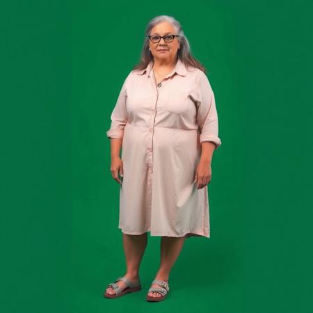 masterpiece portrait of British plus size woman::1.4, Norman Rockwell style::1.2, photographic realism art::1.1
(physical description: full body shot:1.5, mature plus size woman with fair skin and visible wrinkles, long grey hair, soft posture:1.1)
(facial features, expression: calm, expressive mature face with relaxed expression and gentle wrinkles, distinctive eyeglasses:1.0)
(clothing details: light-colored collared knee-length shirtdress, possibly pink or peach, modest and flowing fabric, pendant necklace visible at collar:1.0)
(accessories: two-strap velcro sport sandals:0.9)
(background setting: standing in front of a chromakey green background:0.9)
(lighting style: even studio lighting with soft shadows, no color casting:0.8)
(composition and camera framing: full body shot, front-facing, centered in frame:1.0)
(emotional tone or theme: poised and neutral, designed for flexible background replacement:0.9)
(technical execution: high-resolution detail, neutral lighting for editing flexibility:0.8)