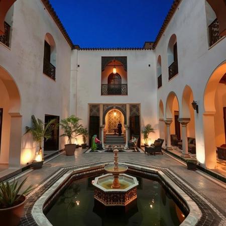 Nice inner courtyard of Arabic traditional Moroccan house, a pond with fountain,sitting area، night time, people in courtyard
masterpiece,best quality,amazing quality,very aesthetic,newest, arabic house, no human, Nice interior ,courtyard of historical arabic house,no human, Moroccan style,middle Eastern