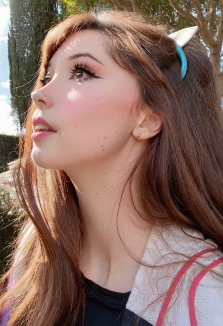 Belle Delphine, a closeup sideview of a woman with long brown hair and looking up