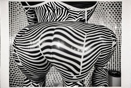 An award winning genre defining documentary candid photograph of ,three female dancers of the experimental conceptual performance artists, they're wearing a wild expressive skin tight jumpsuit by Pucci, at a wild drunken party, the room is filled with onlookers to their bizarre performance,  Brazilian Tropicalia retrofuturism,  Leica M3, 50mm lens, candid photography <lora:CultFlix-SD15:2> strong drop shadows, depth of field stereoscopic effect,  <lora:cursed images:1>