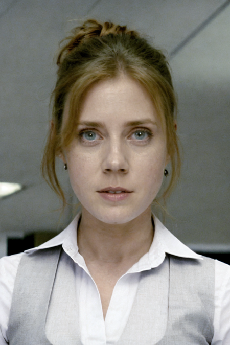 1girl, a woman in a white shirt and gray vest looking at the viewer, (office backdrop)
 <lora:lois_lane_mos_lora_v01:1> llane