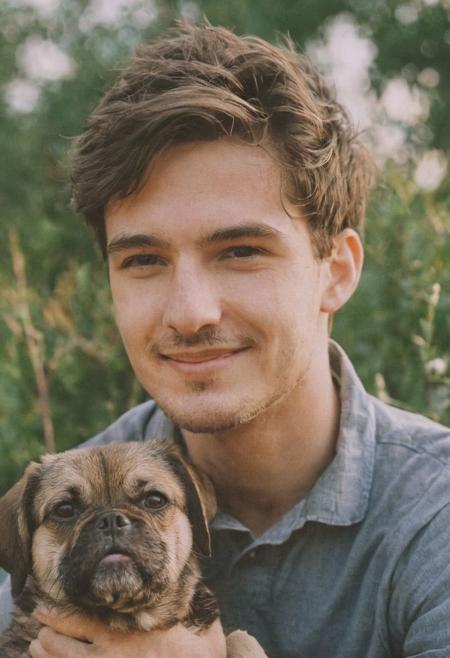cinematic film still fashion photography portrait of 1man with cute dog as companion, headshot, sunlight , Fine Art & Beauty Photography – ,,light diffraction in frame, dreamy,hazy look.  Helios 44-2 lens mounted on a Praktica MTL 5B Helios 44M-4 lens, 58mm f/2,   in a garden. authentic happy smile towards camera, <lora:hand 4:0.3>