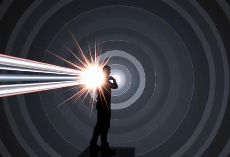 A chrome and silver beam hitting a human 100 metres away. The beam is about 1 metre thick and surrounded by multiple concentric grey and white circles of varying diameter. The target is silhouetted and is in an action hero pose