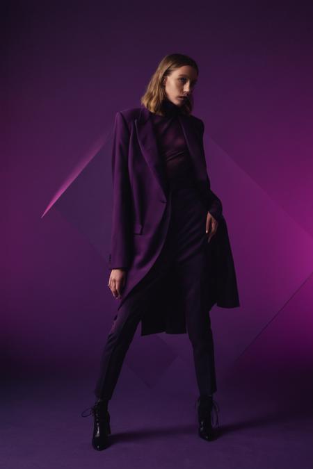 A professional (fashion photo photography:1.2),a  (studio portrait:1.2),showing (surrealistic geometric relationships:1.1),(deep purple gradient background:1.2),(exaggerated character movements:1.5),dramatic lighting,philosophical dimensions,NIKON Z9,35mm,f/1.2,RAW format,stark composition.,(muted tones:1.2),award winning photo,(dream-like quality:1.2),