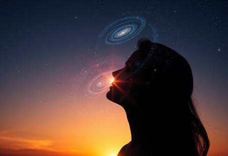 Softly fading sunlight casts a warm glow on the woman's serene face, her silhouette a celestial canvas of swirling galaxies and shimmering stars. Ethereal light dancing across her features, as a radiant aura envelops her, merging harmoniously with the sky's gentle hues. The cosmos within her outline twinkles like diamonds scattered across the heavens, taking refuge within her essence.