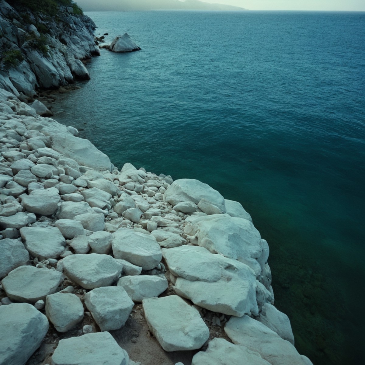 cinematic film still of  <lora:Ron Fricke style:1>
a view of a body of water with a lot of white rocks,outdoors,day,water,...