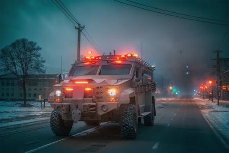 analog gloomy photo of a SWAT armored car,  <lora:sw4tb34rc4t:1>, ((zombie apocalypse:0.6)), (crows), (living dead), (winter), (snow), (horror movie), ((nighttime)), a deserted city, ruins, abandoned buildings, High Detail, Sharp focus, (photorealism), realistic, best quality, 8k, award winning, dramatic lighting, epic, cinematic, masterpiece, rim light, ambient fog:1.3, dutch angle, depth of field,