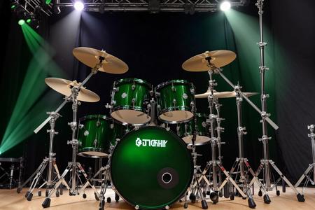 <lora:Drum Set 3:.9> photo of green color drum set located on a rock concert stage, concert lighting, LED spot lights, centered in frame, <lora:epiNoiseoffset_v2:1.1>