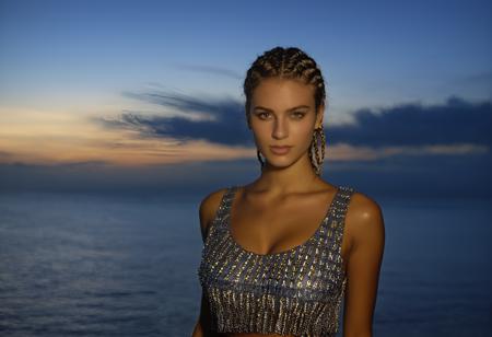 sptsillu realistic 1girl solo 24 year old, medium breasts, Gray cornrows, caucasian, dark skin, brown eyes, fair skinned, best quality, RAW photo, subject, 8k uhd, high quality, photorealistic, gilded, Blue hour shot <lora:sprtsillusXLrdi:0.9>