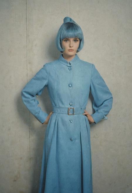 vintage film photograph, analog photography, avant-garde, 1960s photoshoot, dressed in a blue, film grain,