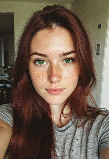 Instagram selfie, ((upper body)), high angle,  a 23 year old gorgeous woman, busty, slight smirk, detailed skin face and eyes, natural lighting, at home, long hair, low contrast, natural face, freckles, dark red hair, green eyes