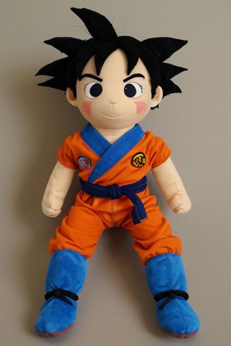 1 plush \(son goku\) , black hair, orange gi, blue wistbands, blue boots, room.