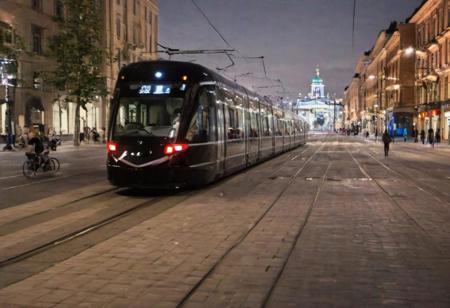 Raw photo,( shallow depth of image:1.2), (minimalistic:1.4), outdoors, wide shot of the downtown of Helsinki, tram, bike riders, night, black bullet train, 38 mm photograph, professional, FOV, HDR, natural lighting, motion blur, lowfi, KodakPhotoMaybe, Photographer Reuben Wu Style