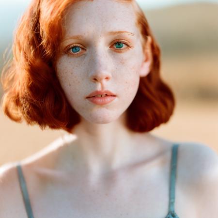 analog style, film, dust, grain, photo of 30 y.o woman in wastelander clothes, redhair, short haircut, pale skin, detailed face, <lora:epiNoiseoffset_v1:1>, <lora:ArgieFilm-01:1>