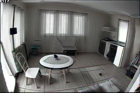 a living room with a table and chairs, window in the background, style_cctv