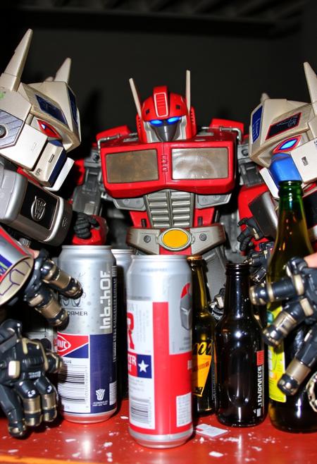 Drunk Transformers, very very drunk, empty beer cans and bottles, wasted.