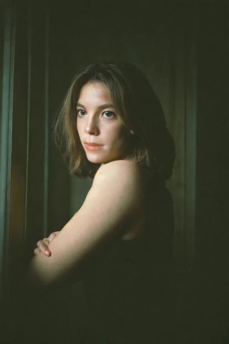 analog portrait photograph of a feminine french woman, dark room, Porta 160 color, shot on fujifilm, by kyunginc