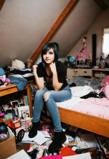 There is a professional photo of a cute sexy girl sitting in a messy room,in a bedroom,messy room,in a room,inside a messy room,in my bedroom,in her room,in an attic,chaotic bedroom,sitting in her room,messy bedroom,cluttered room,ghostly girl bedroom,in small room,dirty room,cluttered,a room,happy vibrant colors,emo style girl,erotic masterpiece,GREATEST DOF f/22,dslr,ultra quality,sharp focus,tack sharp,film grain,Fujifilm XT3,crystal clear,8K UHD,highly detailed glossy eyes,high detailed skin,skin pores,smooth skin,REALISTIC BACKGROUND,slim physique,very close-up,