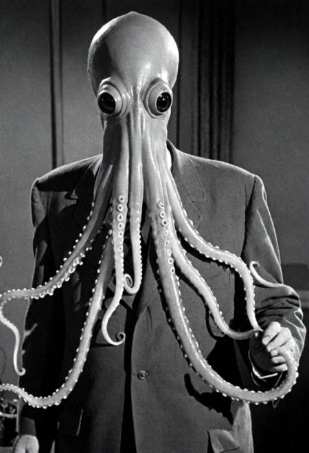 1950s detective film, atrocious tentacle squid anrthomorph humanoid, squid man, monster man. Captured on a 35mm camera, black and white, classic film noir film.