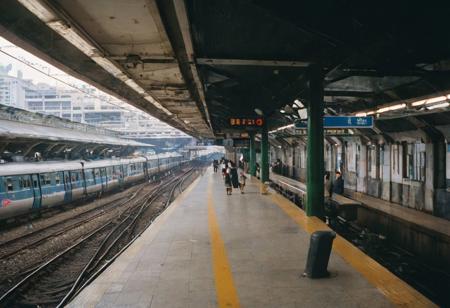 leica m3, 35mm Voigtlander lens, Portra 160/400, photo of Hong Kong Metro Train Railway station in the 1980s, high resolution, high contrast, natural  sunlight
