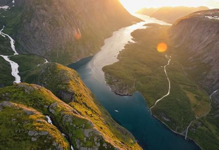 A from_above bird's-eye_view flying through a majestic fjord in Norway, summer, sunset