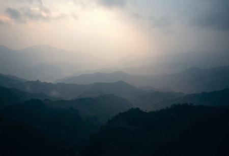 Incredibly beautiful, breathtaking landscape. Desktop wallpaper. limited dark palette, unusual dark colors, faded colors, atmospheric haze, highly dramatic cinematic lighting, film grain, professional, superb composition, fine detail, maximum detail, extreme level of detail, masterpiece, best quality
