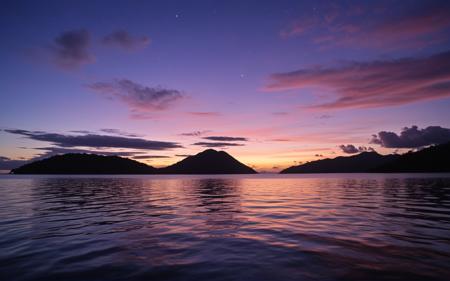 Stable_Yogis_PDXL_Positives,,A captivating view of the islands of Papua New Guinea at twilight, where the sky transitions to deep blues and purples, Silhouettes of the islands against the colorful sky create a tranquil and inviting atmosphere, perfect for capturing the beauty of this remote region,, score_9, score_8_up, score_7_up