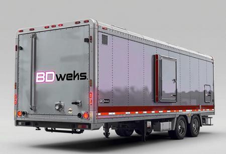 1 vehicle, 
cyberpunk  oversize  industrial trailer.  
Logo label "BDwerks®" written on the side nothing else written.