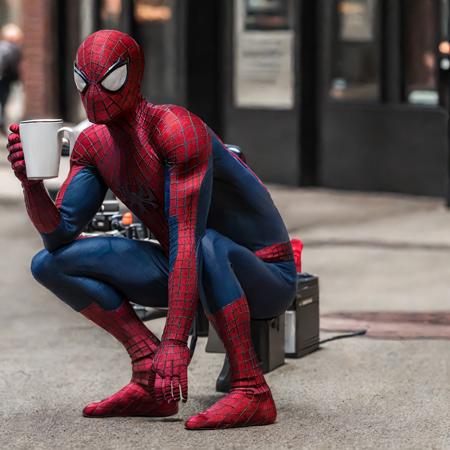 tasm2spdrmn holding coffee cup in his hand, hyperrealistic, Fujifilm XT3 <lora:tasm2spdrmn_v2:0.75>